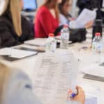 Specification sheet read by Fashion week attendee